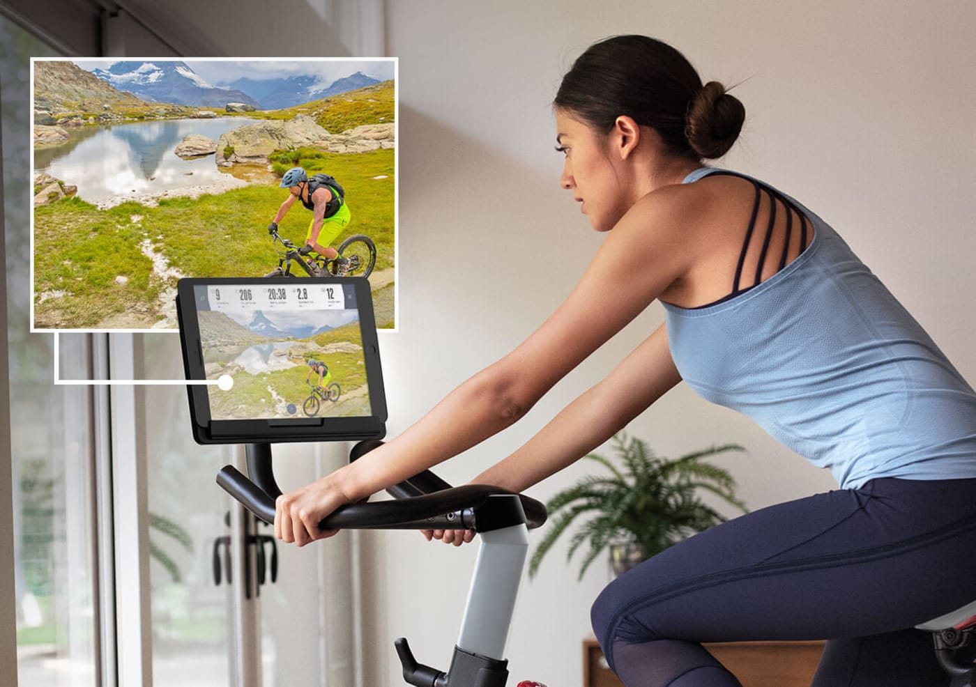 woman using her exercise bike in her home