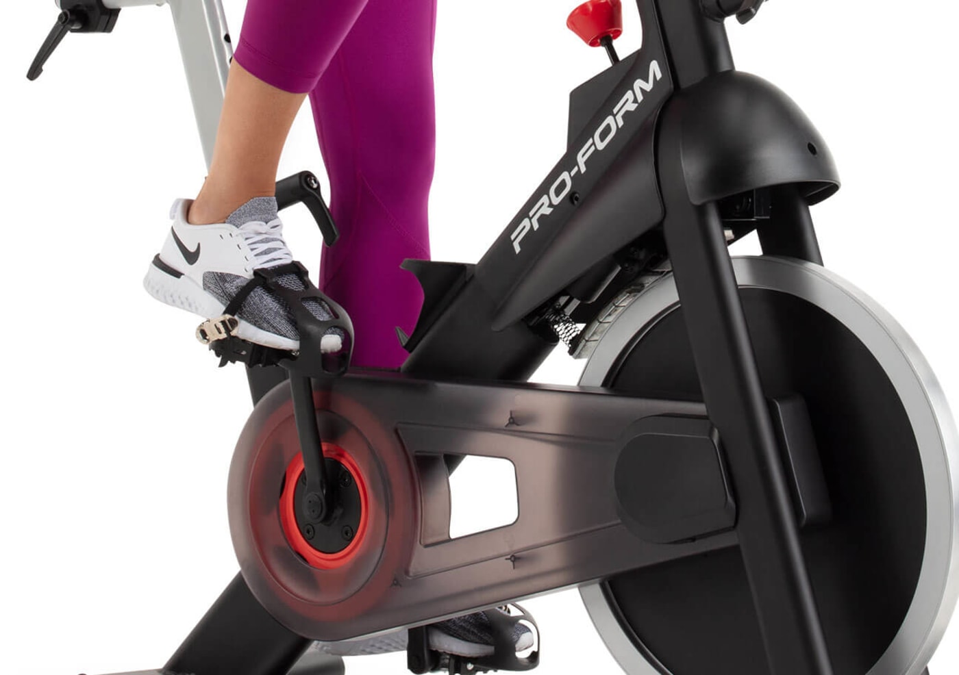 image of a woman pedaling the exercise bike