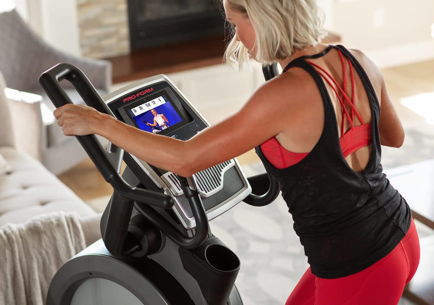 Woman riding the Carbon HIIT H7.
