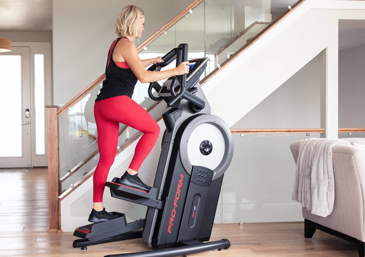 Woman riding the Carbon HIIT H7