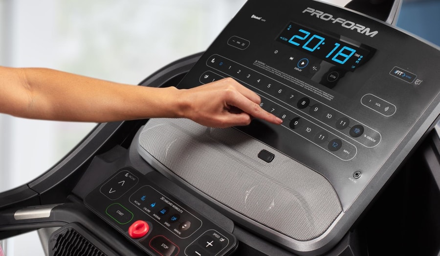 person pushing buttons on the console
