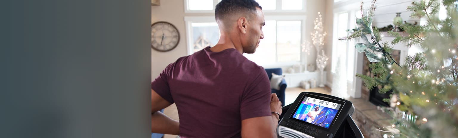 woman running on a treadmill in her home large