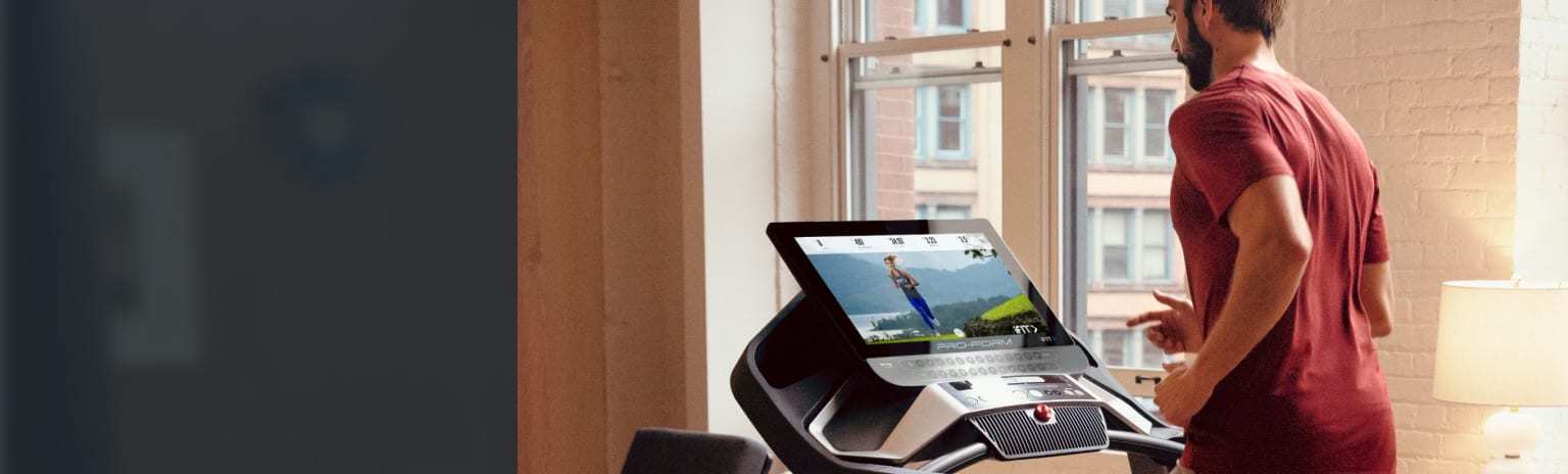 Man running on the Pro 9000 treadmill in his home. large