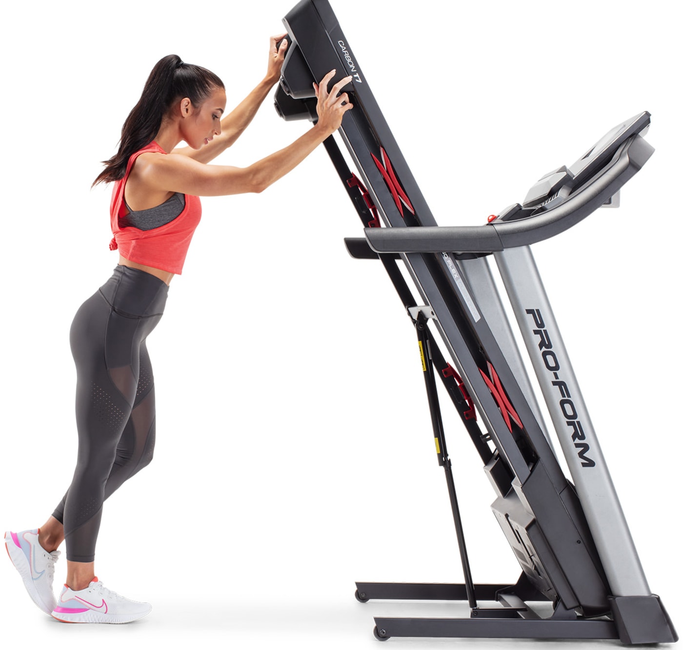 woman folding the treadmill