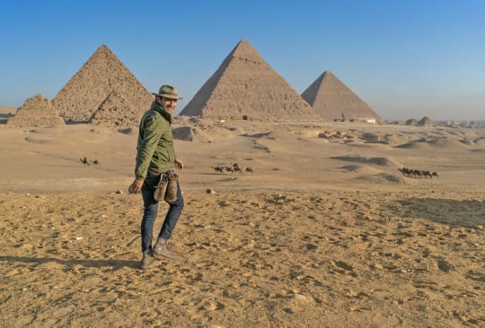 Trainer walking in Egyption desert