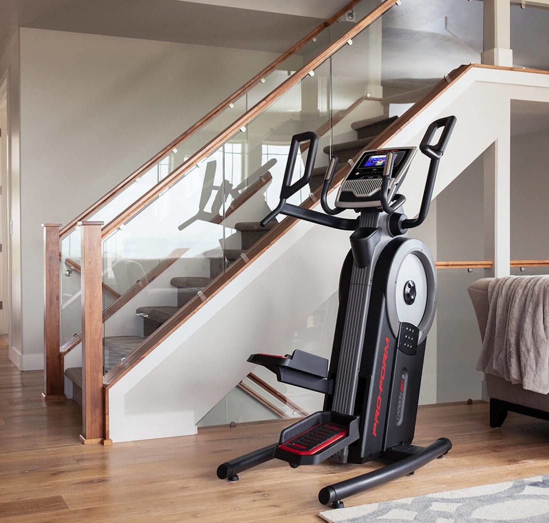 Carbon HIIT H7 stored perfectly right by a stairway.