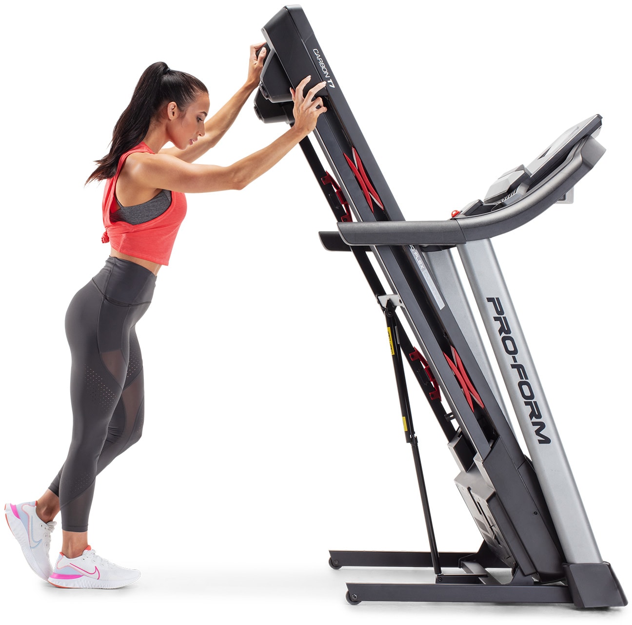 woman folding the treadmill