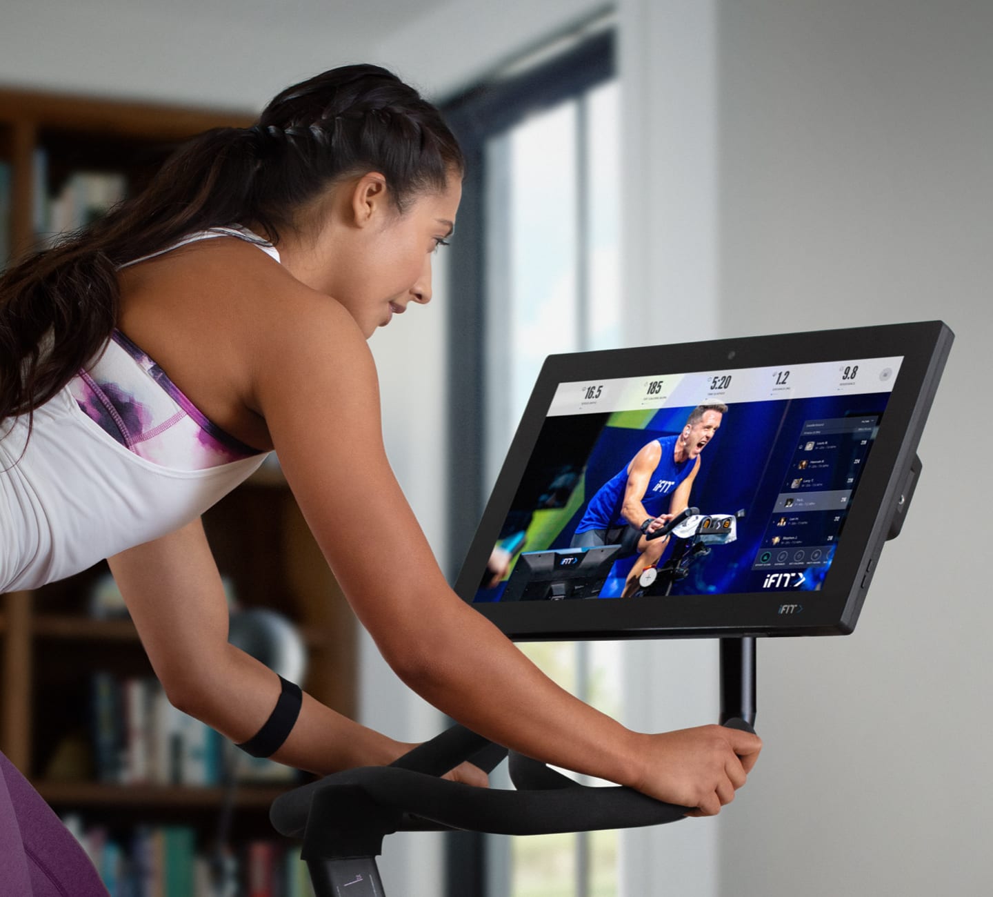 Woman riding the Studio Bike Pro 22.