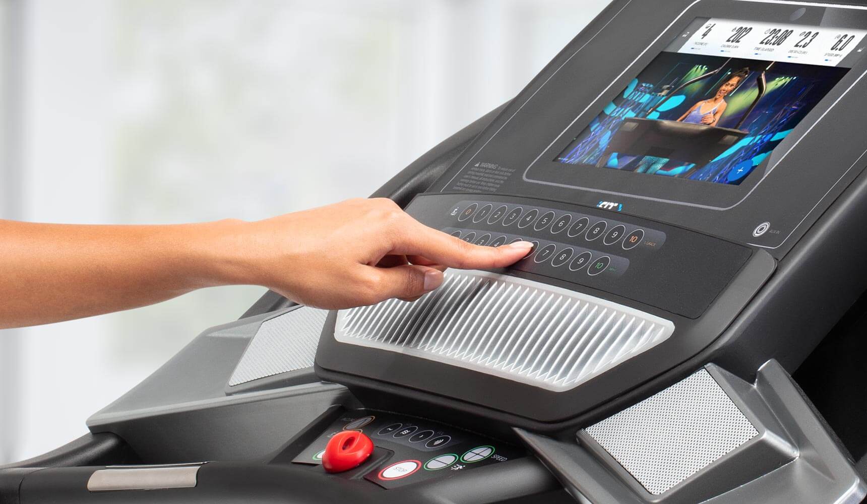 person pushing the buttons on the console of the performance 600i