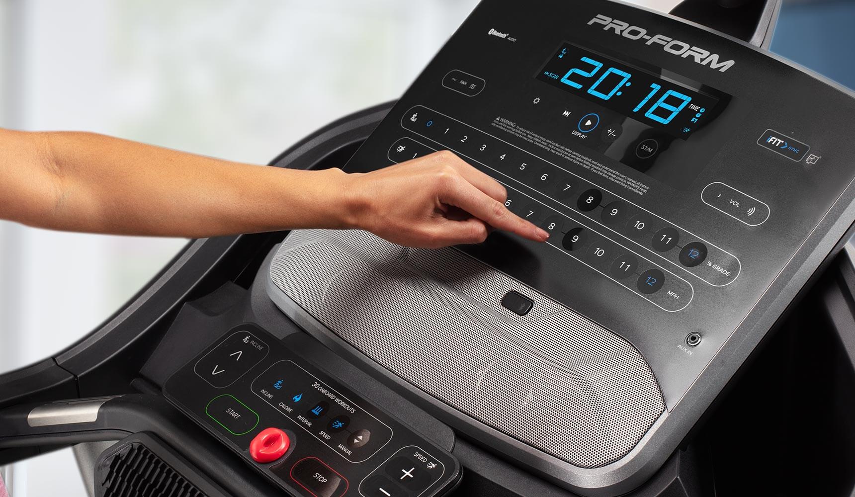 person pushing buttons on the console
